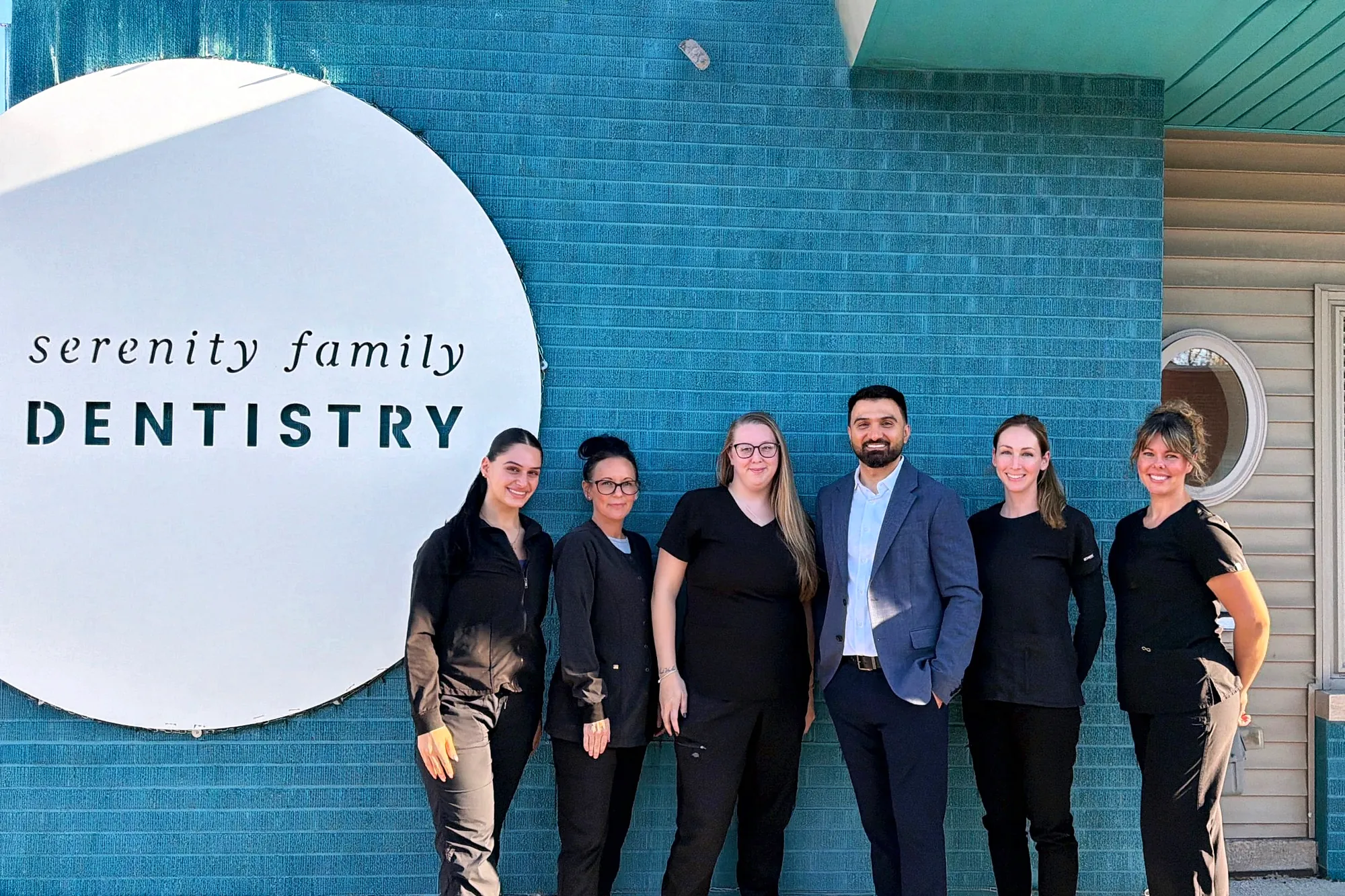 The Serenity Family Dentistry team outside the office on Crooks Road in Royal Oak